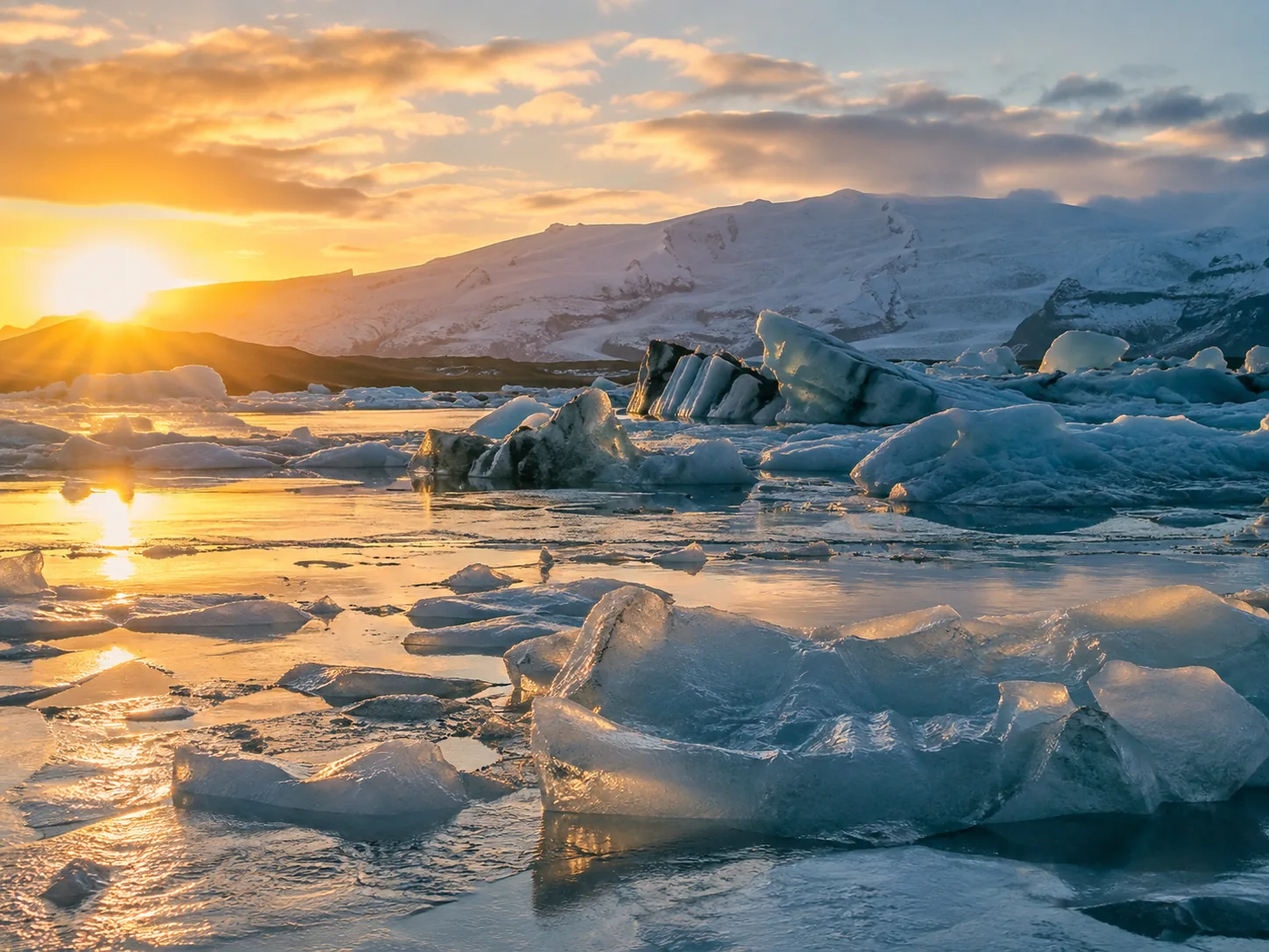 low winter light over icebergs.